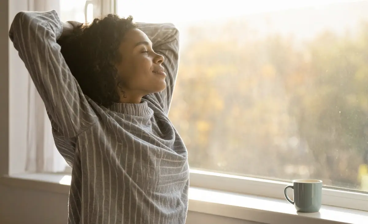 Relaxed business owner enjoying a calm morning by the window
